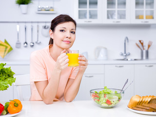 Beautiful woman with orange juice