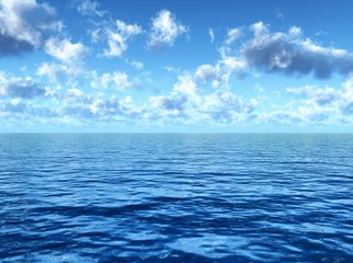 Fototapeta na wymiar cloudy blue sky above a blue surface of the sea