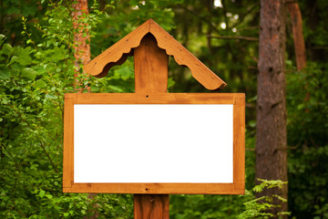 wooden signboard in the forest