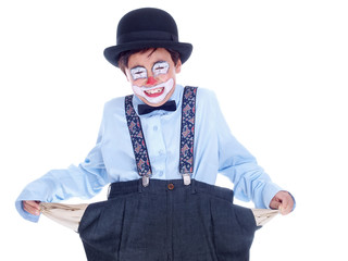 crying child clown showing his empty trousers pockets