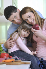 happy young family in kitchen