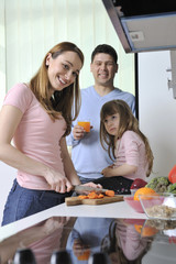 happy young family in kitchen