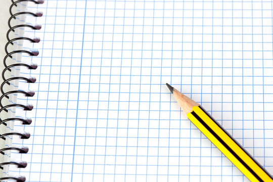 Sharp pencil on a spiral notebook