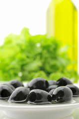 Black olives, greens and oil