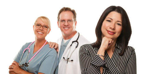 Hispanic Woman with Male Doctor and Nurse