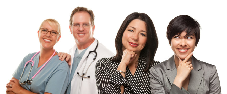 Hispanic Mother And Daughter With Doctor And Nurse