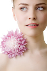 Obraz na płótnie Canvas beautiful woman with pink flower on white background