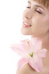 Beautiful woman with pink lily isolated on white