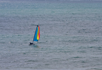 Colorful Sailboat on Blue