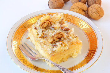 Cake with walnuts and coconut icing