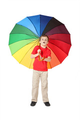little boy in red shirt opened mouth with multicolored umbrella