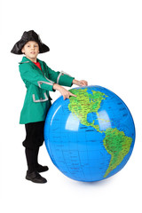 little boy in historical dress standing with inflatable globe