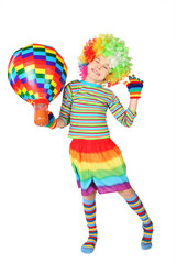 boy in clown dress with multicolored hot-air balloon standing