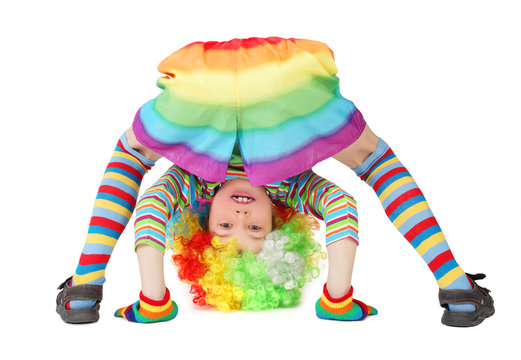 Little Boy In Clown Dress Somersault Isolated On White