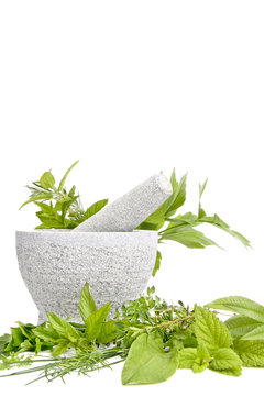 Granite mortar with herbs, isolated