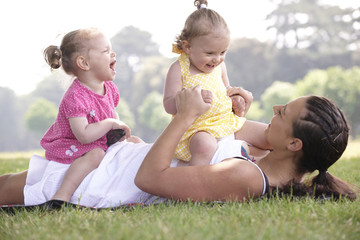 mother playing with daughters