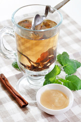 Cup of tea with  honey and herbs