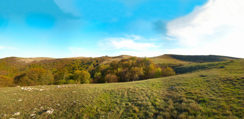 Panorama. Hills with cloudscape