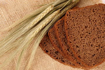 Wheat, bread on a bast mat