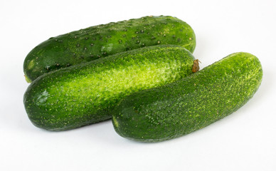 A fresh green cucumber isolated on a white background