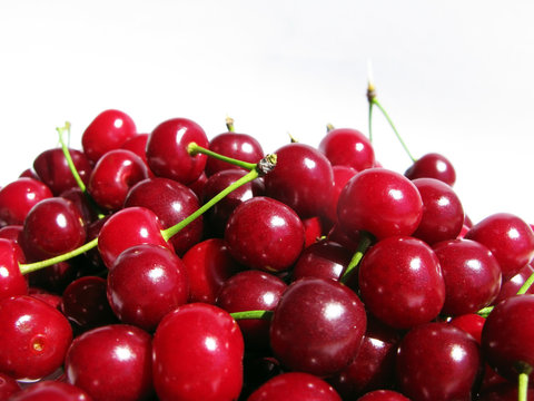 Wonderful red cherries on white background