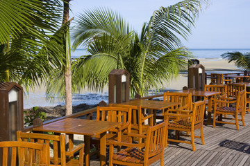 Table and chairs in empty cafe  at island Koh Chang , Thailand.