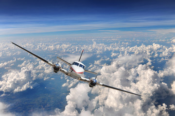 Airplane Flying above the clouds