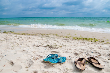 Fototapeta na wymiar Shoes near sea