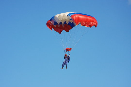 a parachute is in dark blue sky
