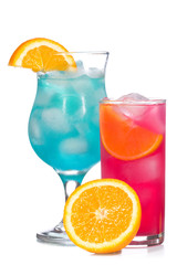 Blue and red cocktails with fruits