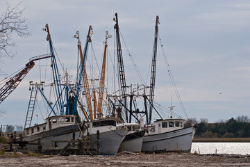Four Old Fishing Boats on River