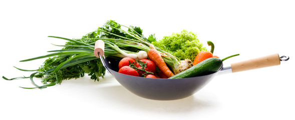 Fresh vegetables in chinesse wok on white background