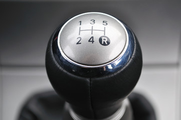 Car's shift lever. Five gears. Shiny metallic surface.Gearshift.