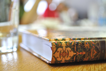 Diary/book on the table.