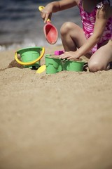 Child Playing In The Sand