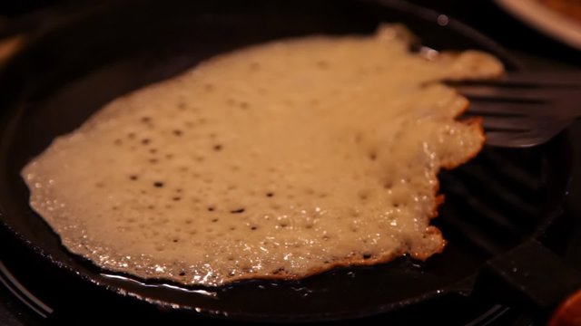 blin baked on frying pan