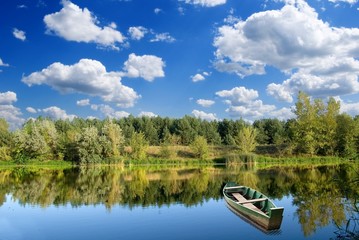 Obraz premium fisher boat on a river