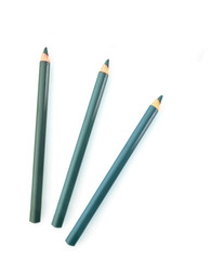 three blue eyebrow pencils on white