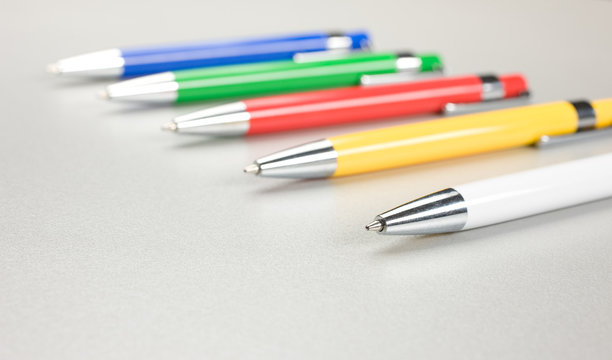 Set of colored pens on table