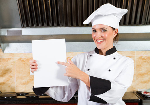 Chef Holding A White Board Or Menu In Kitchen