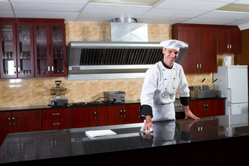 happy chef cleaning kitchen