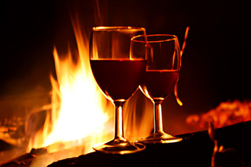 Night romance. Vine against fire.