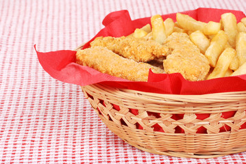 chicken fingers and french fries in a basket