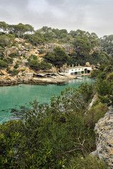 Cala Pi bay and traditional fishing boat huts
