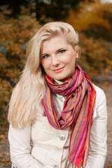 beautiful autumn woman in yellow park