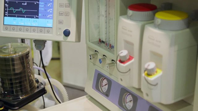volume ventilator, pump in flask, tubes, gauges and monitor