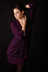 Obraz premium Fashion model in purple mini dress