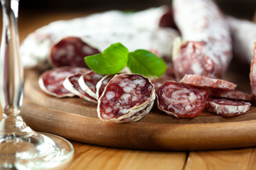 French dried sausage on rustic wooden table
