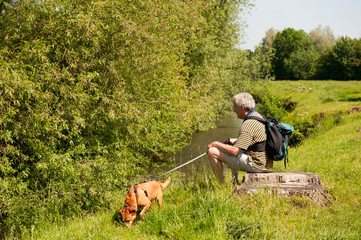 Elderly man with dog