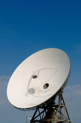 satellite communication disc against blue sky